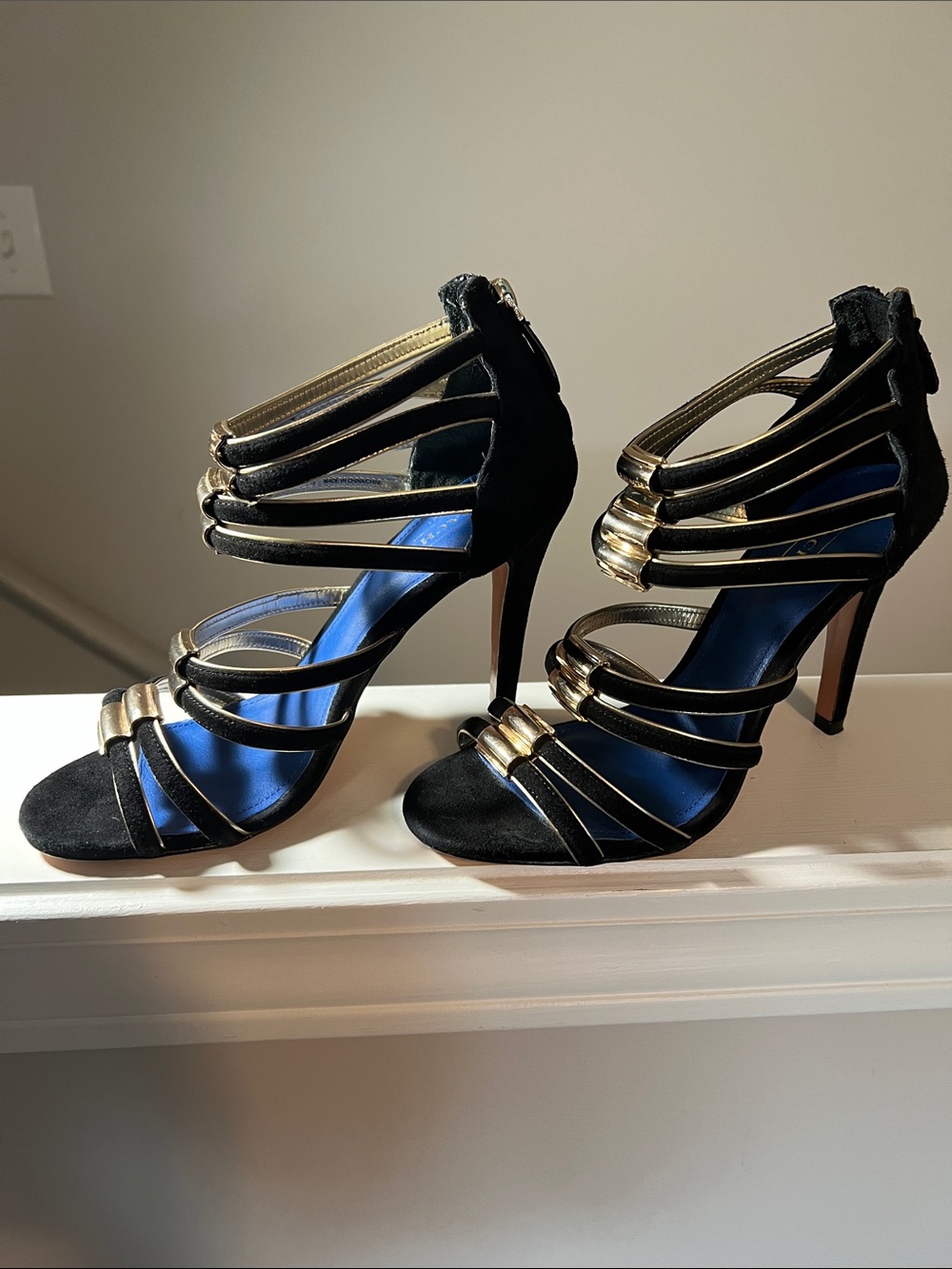 COACH Black Leather Strappy Heels with Gold Accents and Blue Insole